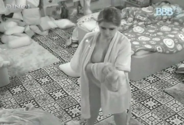 A young girl fondles herself while she is being watched on a hidden camera