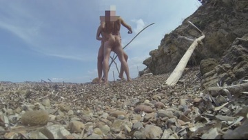 At the naturist beach, a stranger offers to fuck me before his wife comes back and surprises us