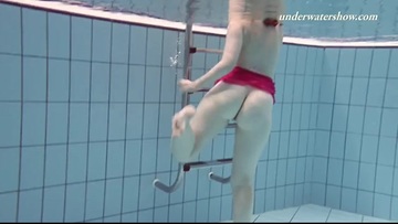 Naked bitch in the pool underwater