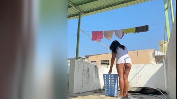 I peek at my busty neighbor while she hangs laundry.